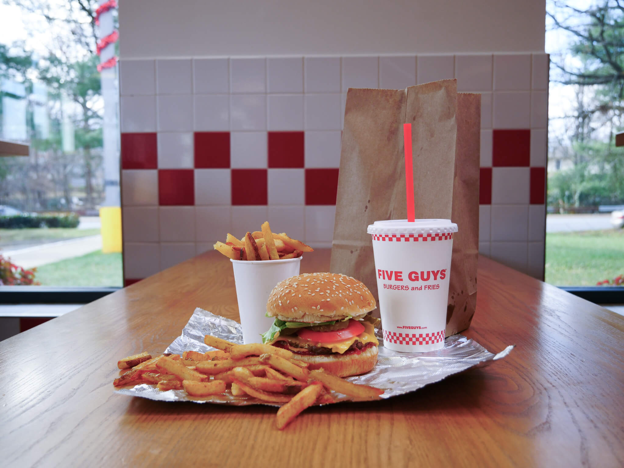 A burger combo with fries and a shake.